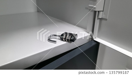 A lock with a code mechanism. Protection of personal belongings using a lock with a code mechanism in lockers. High quality photo A lock with a code mechanism. Protection of personal belongings using a lock with a code mechanism in lockers. High quality photo 135799187