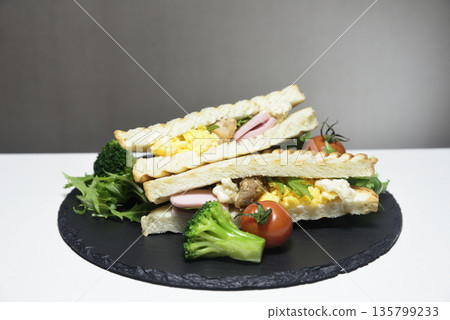 Hot sandwiches served on a plate 135799233