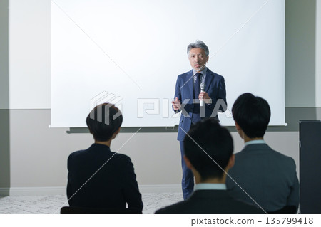 Businessman giving a speech at a seminar 135799418