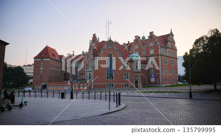 Historic brick building in Gdansk old town at dusk 135799995