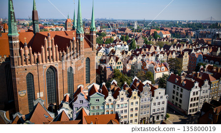 Gdansk old town skyline with historic church and colorful townhouses 135800019