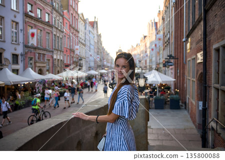 Woman on bridge above Old Town street market in Gdansk Poland 135800088
