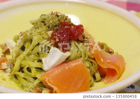 A luxurious pasta dish with salmon, Camembert cheese and salmon roe in a pesto sauce A luxurious pasta dish with salmon, Camembert cheese and salmon roe in a pesto sauce 135800458