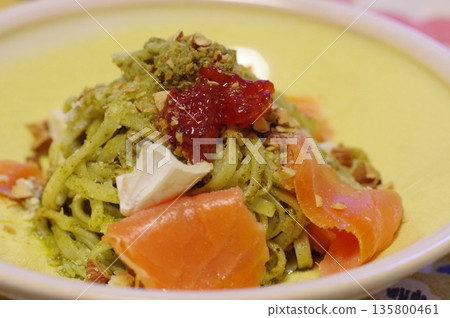 A luxurious pasta dish with salmon, Camembert cheese and salmon roe in a pesto sauce A luxurious pasta dish with salmon, Camembert cheese and salmon roe in a pesto sauce 135800461