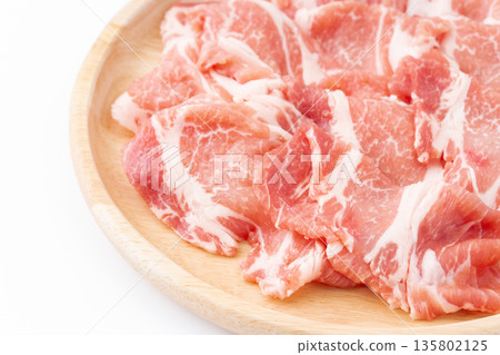 Close-up of thinly sliced raw pork shoulder 135802125