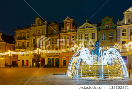 Poznan Old Market Square with illuminated fountain and colorful buildings 135802271