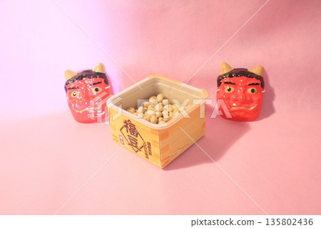 Red demon and lucky beans on a pink background 135802436
