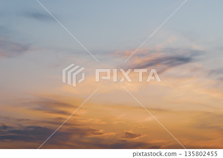 Orange-tinted evening clouds a-4 cool color 135802455