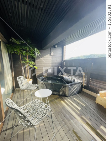 A stylish open-air bath with a mountain view A stylish open-air bath with a mountain view 135802591