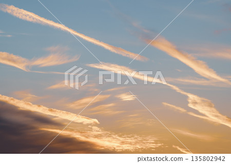 Sunset sky with many contrails A-4 Cool color Sunset sky with many contrails A-4 Cool color 135802942