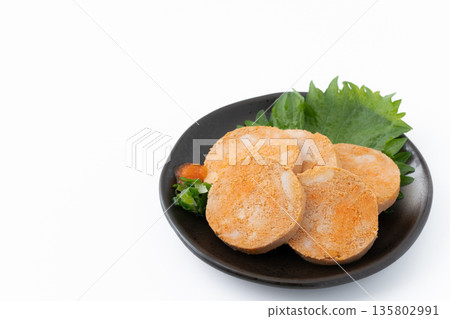 Monkfish liver served on a plate on a white background 135802991