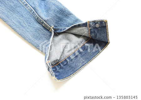sleeve of blue denim shirt texture isolated on white background, jean fashion style 135803145