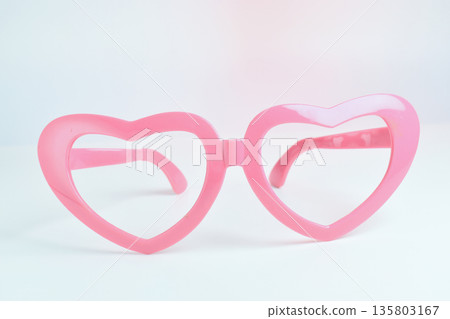 pink heart shape of glasses on white background 135803167