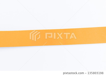 yellow leather strap isolated on white background 135803198