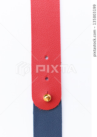 dark blue and red leather strap isolated on white background 135803199