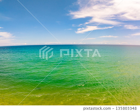 Beautiful sea in summer season blue sky white cloud background Beautiful sea in summer season blue sky white cloud background 135803348