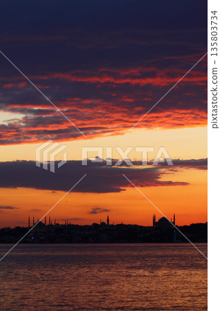Sillhouette of Istanbul at sunset. Ramadan time with the muslim city istanbul silhouette Sillhouette of Istanbul at sunset. Ramadan time with the muslim city istanbul silhouette 135803734