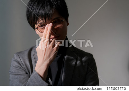 Suspicious man wearing sunglasses 135803750