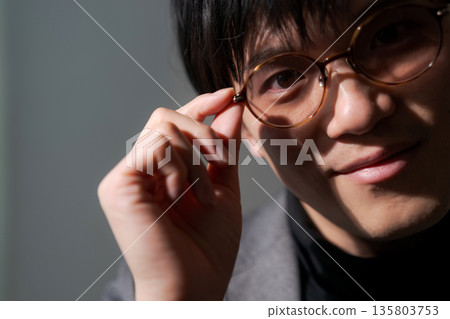 Suspicious man wearing sunglasses 135803753