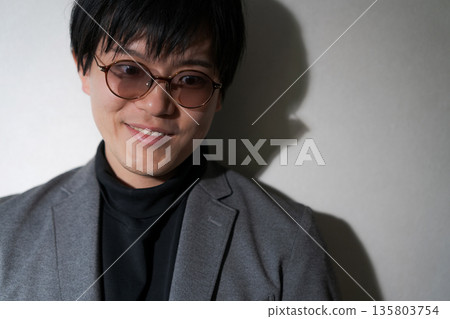 Suspicious man wearing sunglasses 135803754