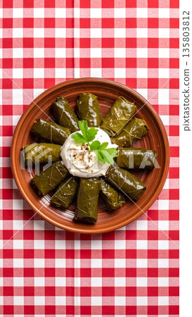 Dolmades on Gingham Tablecloth Dolmades on Gingham Tablecloth 135803812