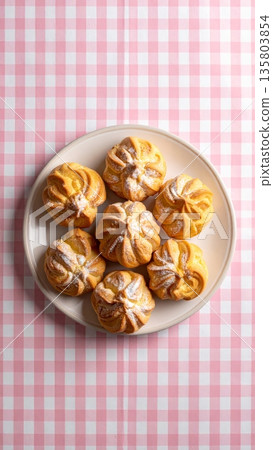 Cream Puff on Gingham Tablecloth Cream Puff on Gingham Tablecloth 135803854