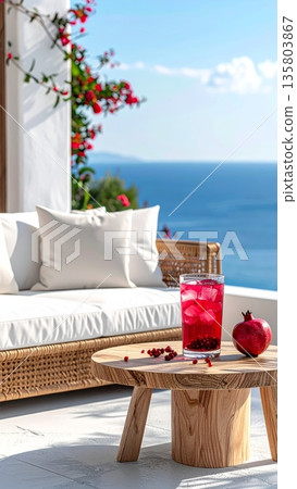 Pomegranate Juice on Wooden Coffee Table by Mediterranean Balcony 135803867