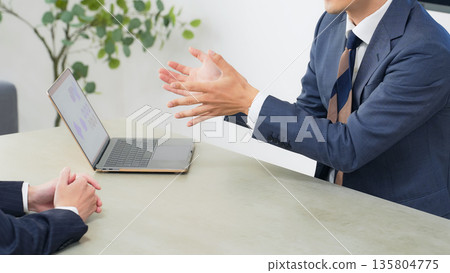 Group of business people meeting in an office Group of business people meeting in an office 135804775