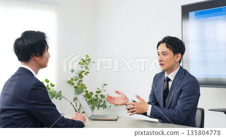 Group of business people meeting in an office Group of business people meeting in an office 135804778