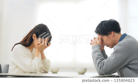 A depressed couple in a room A depressed couple in a room 135804823