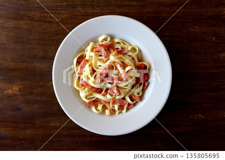 Tagliatelle carbonara on a table background viewed from above 135805695