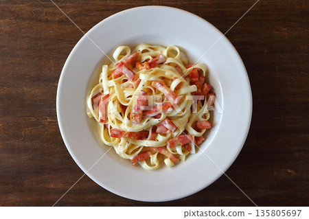 Tagliatelle carbonara on a table background viewed from above 135805697