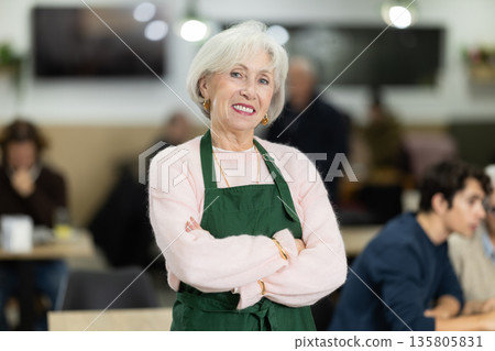 Elderly woman working as a barista in a coffee shop 135805831