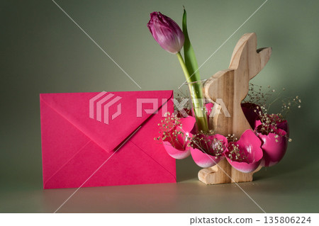 Self made vibrant pink envelope egg shell with wooden bunny vase handmade decoration for Easter holiday. Copy space greeting card present gift ideas. Tulip flower Creative reuse zero waste sustainable Self made vibrant pink envelope egg shell with wooden bunny vase handmade decoration for Easter holiday. Copy space greeting card present gift ideas. Tulip flower Creative reuse zero waste sustainable 135806224