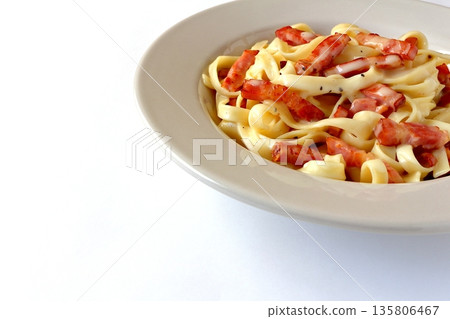 Tagliatelle carbonara with plenty of bacon Tagliatelle carbonara with plenty of bacon 135806467