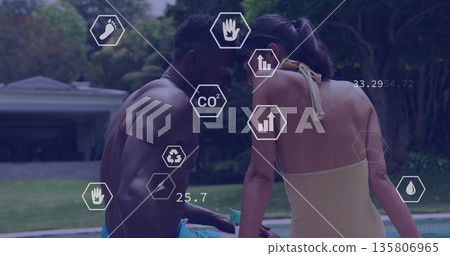 Leaning man and woman in swimwear observing hexagon icons at backyard pool, with metrics overlay Leaning man and woman in swimwear observing hexagon icons at backyard pool, with metrics overlay 135806965