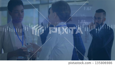 Networking professionals in suits exchanging ideas in conference lobby with lanyards smartphone 135806986