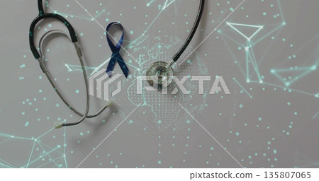 Displaying silver stethoscope and navy blue ribbon on gray table with global data network overlay Displaying silver stethoscope and navy blue ribbon on gray table with global data network overlay 135807065