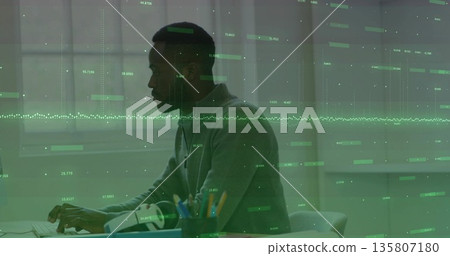 Typing man wearing gray sweater at office desk with keyboard, VR headset, pencil cup, copy space Typing man wearing gray sweater at office desk with keyboard, VR headset, pencil cup, copy space 135807180