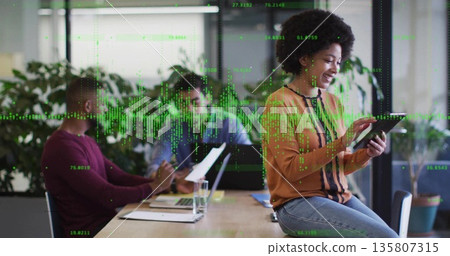 Using tablet, Black female worker consulting data in meeting room, with digital data overlay Using tablet, Black female worker consulting data in meeting room, with digital data overlay 135807315