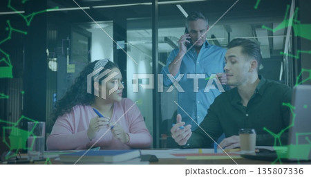 Discussing project ideas, colleagues marking documents on office table with markers and smartphone 135807336