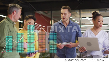 Reviewing business metrics team in formal wear at office, with tablets, laptop and chart overlay Reviewing business metrics team in formal wear at office, with tablets, laptop and chart overlay 135807378
