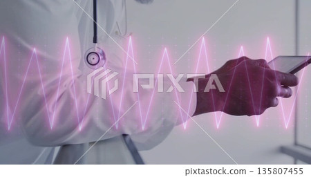 Analyzing doctor in white coat with stethoscope holding tablet in corridor, with pink ECG waveform 135807455