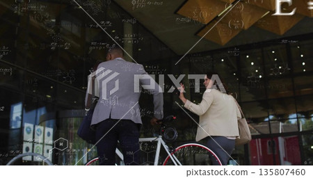 Guiding coworkers in business attire carrying white bicycle with satchel and bag at office entrance Guiding coworkers in business attire carrying white bicycle with satchel and bag at office entrance 135807460