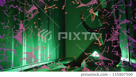 Korean man kneeling, analyzing holographic network in LED server hall with grated floor, copy space Korean man kneeling, analyzing holographic network in LED server hall with grated floor, copy space 135807500