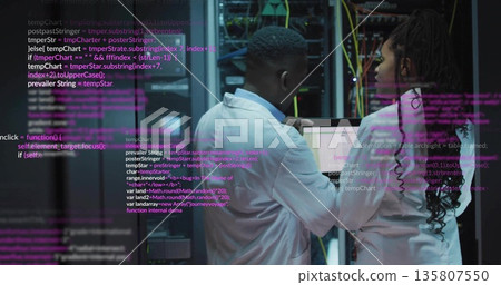 Adjusting network switches lab coat technicians checking servers in data center aisle, with cables 135807550