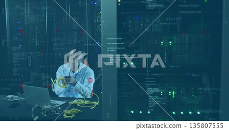 IT technician arranging Ethernet cables in server room racks with laptop, switch, copy space IT technician arranging Ethernet cables in server room racks with laptop, switch, copy space 135807555