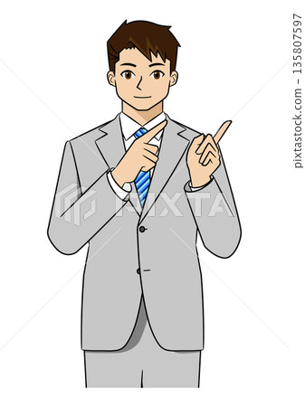A young businessman in a suit explaining by pointing to the left with both hands (upper body) 135807597