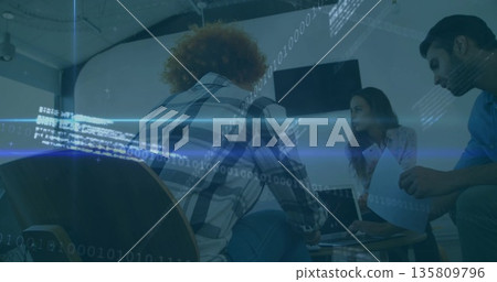 Discussing project details coworkers sitting around coffee table in office, with laptop documents Discussing project details coworkers sitting around coffee table in office, with laptop documents 135809796