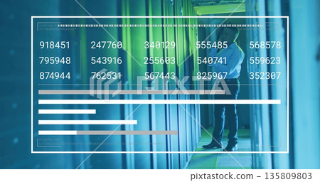 IT tech examining servers inside data center with cables, raised floor panels, digital overlays 135809803